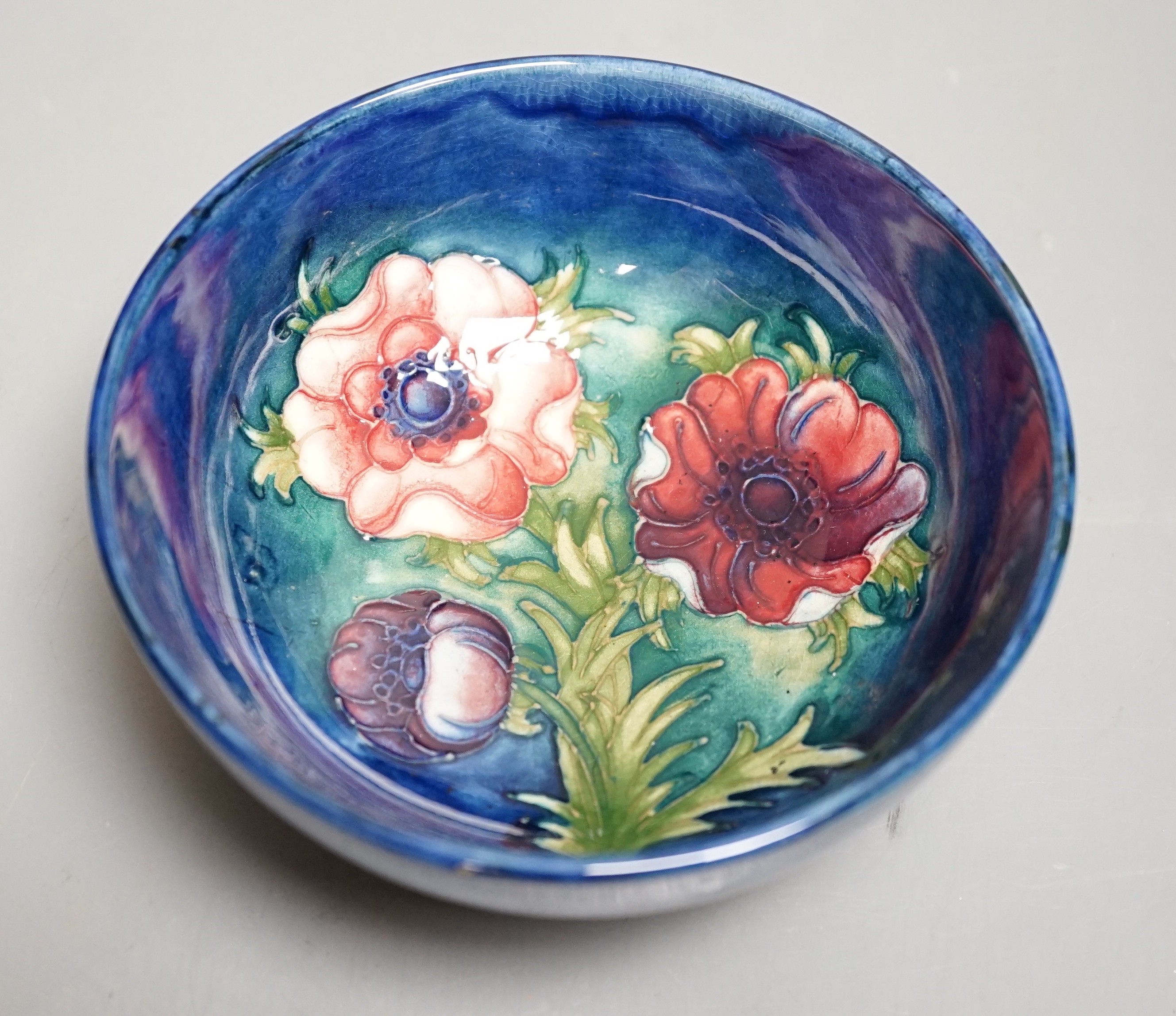 A Moorcroft anemone pattern small bowl, 13cm diameter